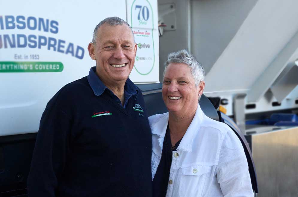 Pam and Gavin Gibson, Gibson Groundspread directors in front of a spreading vehicle